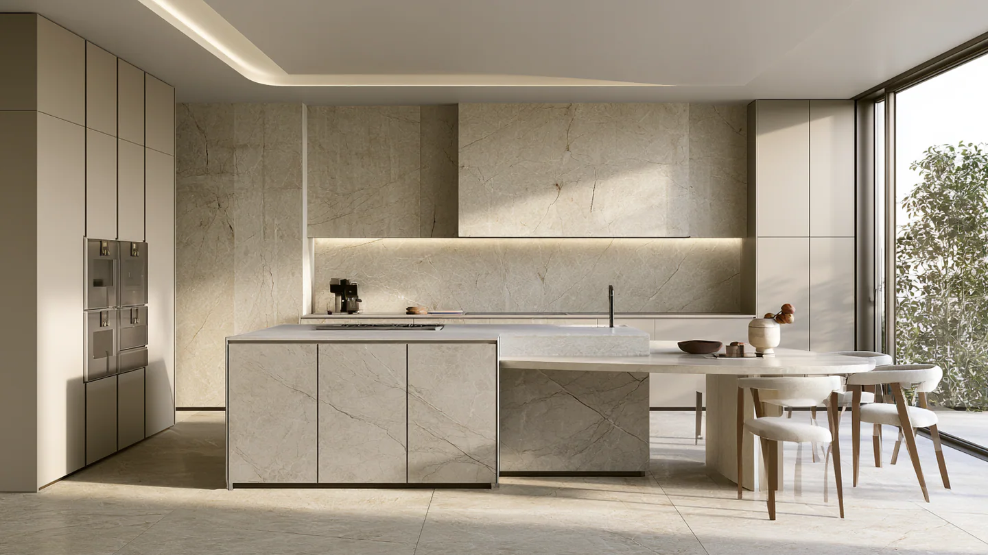 A warm ivory sintered stone kitchen, shown as a wide room view